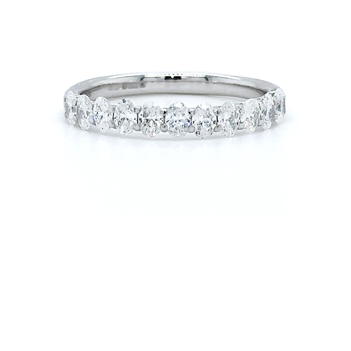 Oval Cut Half Eternity Platinum Claw Set Ring