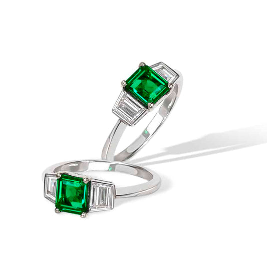 Emerald Cut Emerald and Trapeze Cut Diamond Ring in Platinum